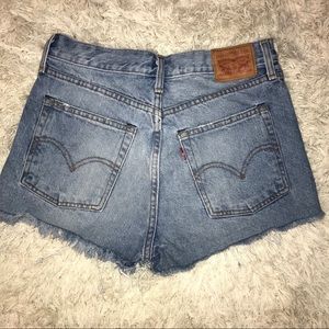 Distressed high- waisted Levi’s